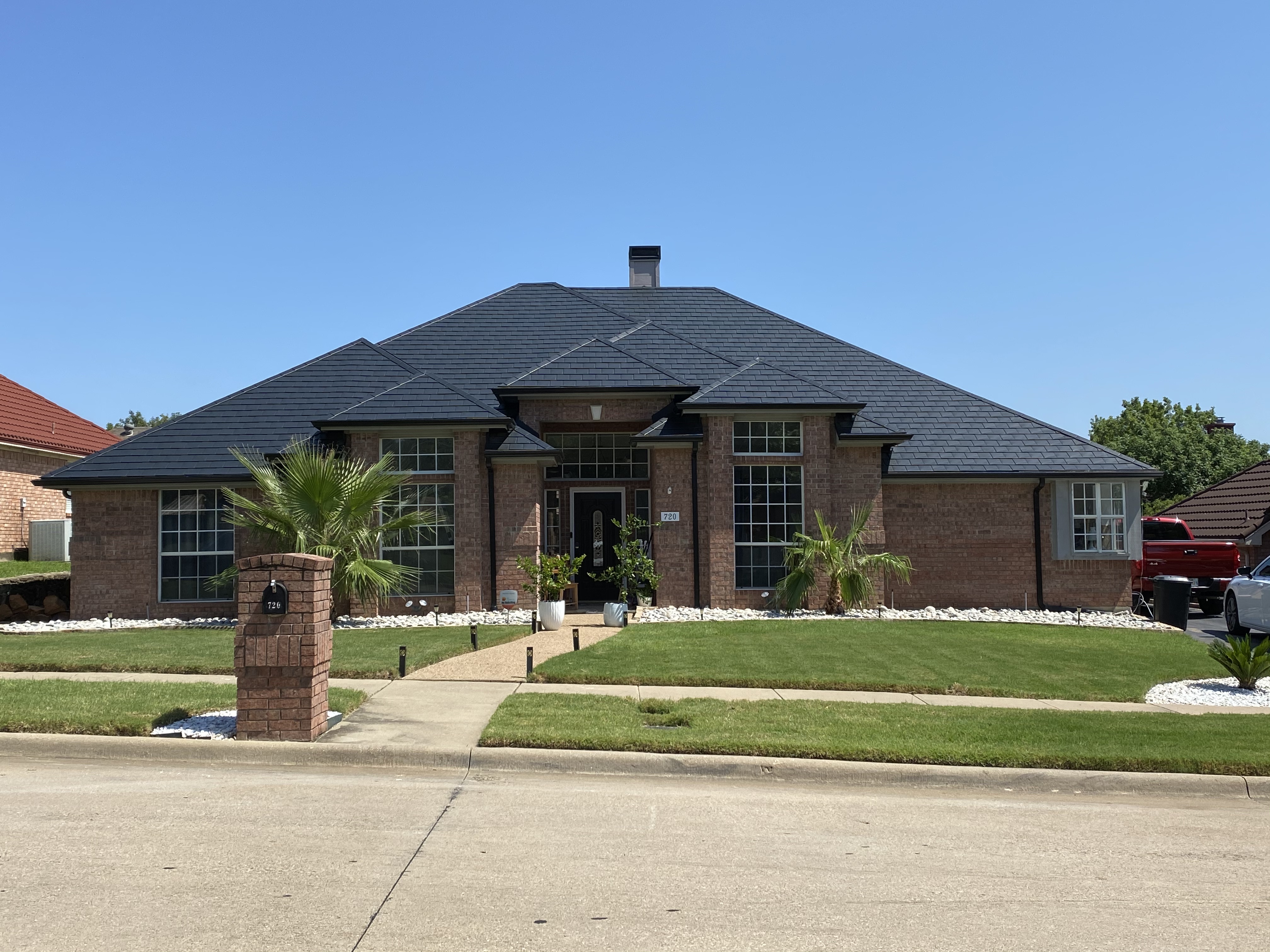 Premium metal roofing on brick estate